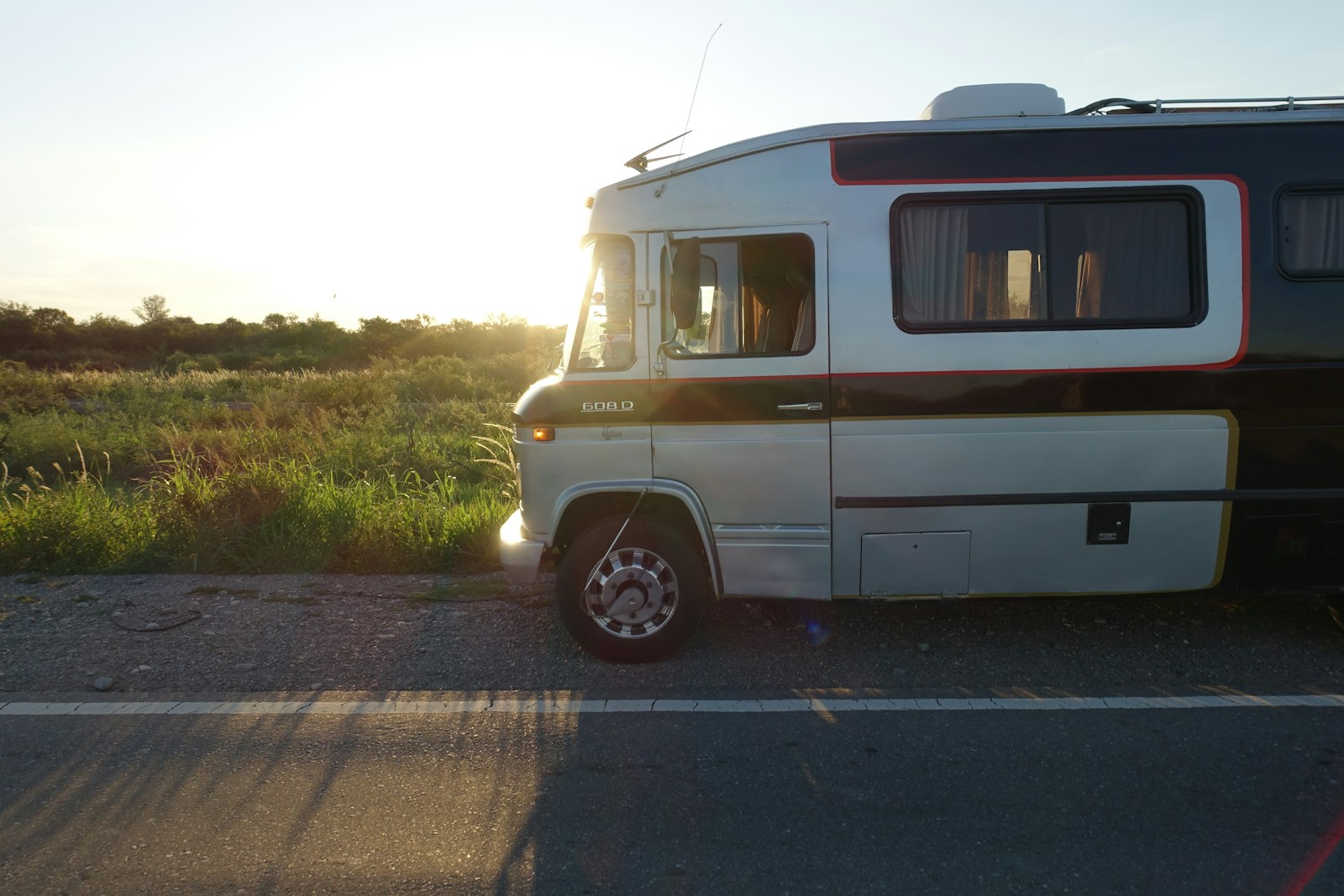 white and brown van on road during daytime
